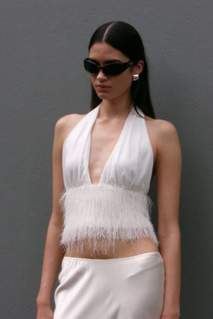 Finley Top by Bec + Bridge, a sleek halter silhouette with a statement fringe underbust detail—perfect for bridal celebrations or chic summer styling.