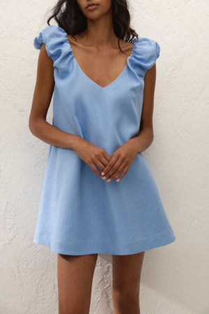 Flor Mini Dress Sky Blue by Faithfull the Brand – a mini dress with frill sleeves and soft A line fit. Perfect for summer styling.