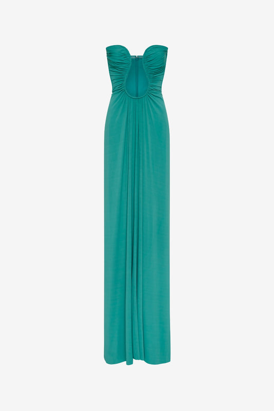 Florence Jersey Dress by Misha, a teal blue strapless maxi with plunge neckline and waist ruching. Perfect for formal events or galas.