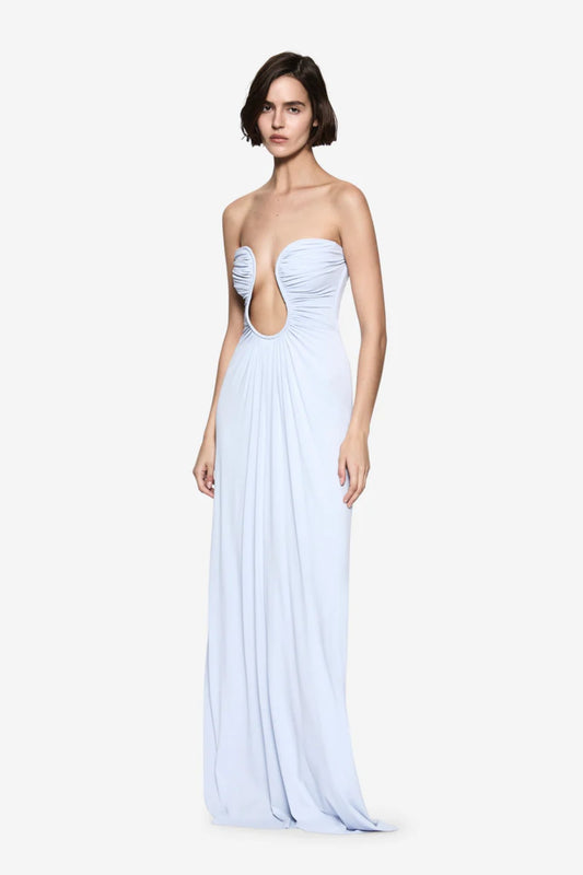 Florence Jersey Dress in Skywriting by Misha, a teal blue strapless maxi with plunge neckline and waist ruching. Perfect for formal events or galas.