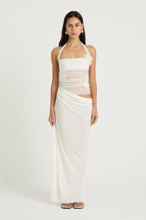Florence Maxi Dress White Flower by Benni, halter mesh bodice with 3D floral decals and draped cupro skirt for romantic, elegant occasions.