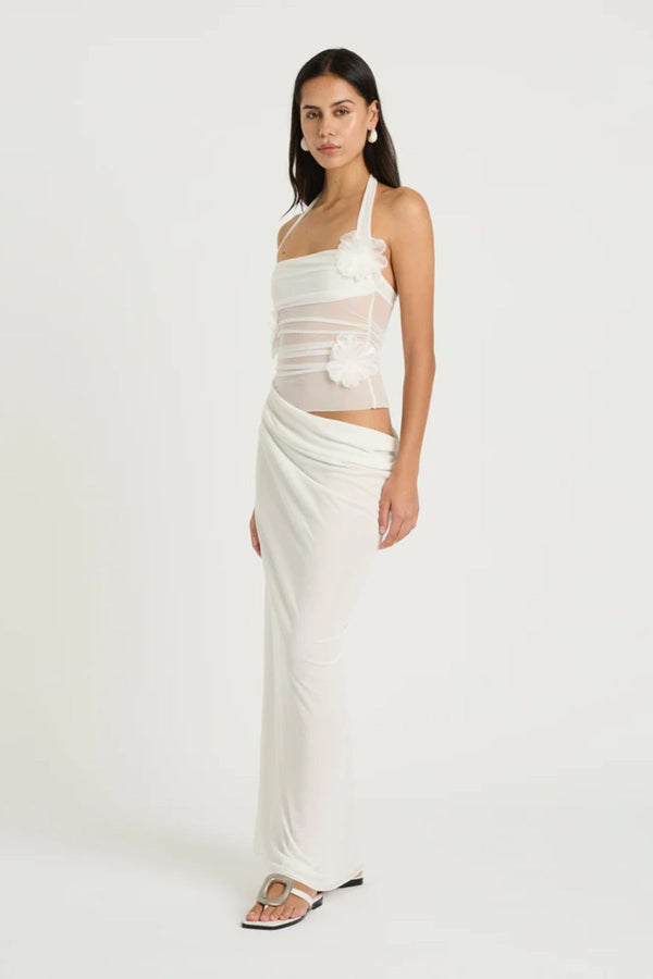 Florence Maxi Dress White Flower by Benni, halter mesh bodice with 3D floral decals and draped cupro skirt for romantic, elegant occasions.