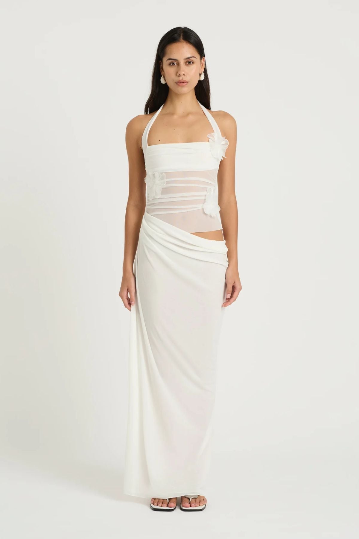 Florence Maxi Dress White Flower by Benni, halter mesh bodice with 3D floral decals and draped cupro skirt for romantic, elegant occasions.