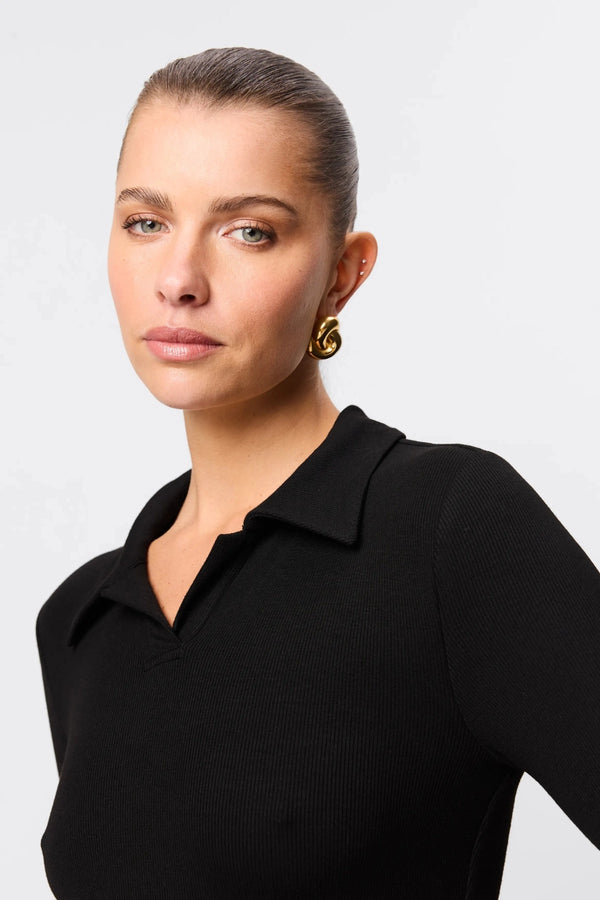 Florence Polo Top in Black by Mossman, a ribbed jersey long sleeve polo with thumb openings and sculpted fit.