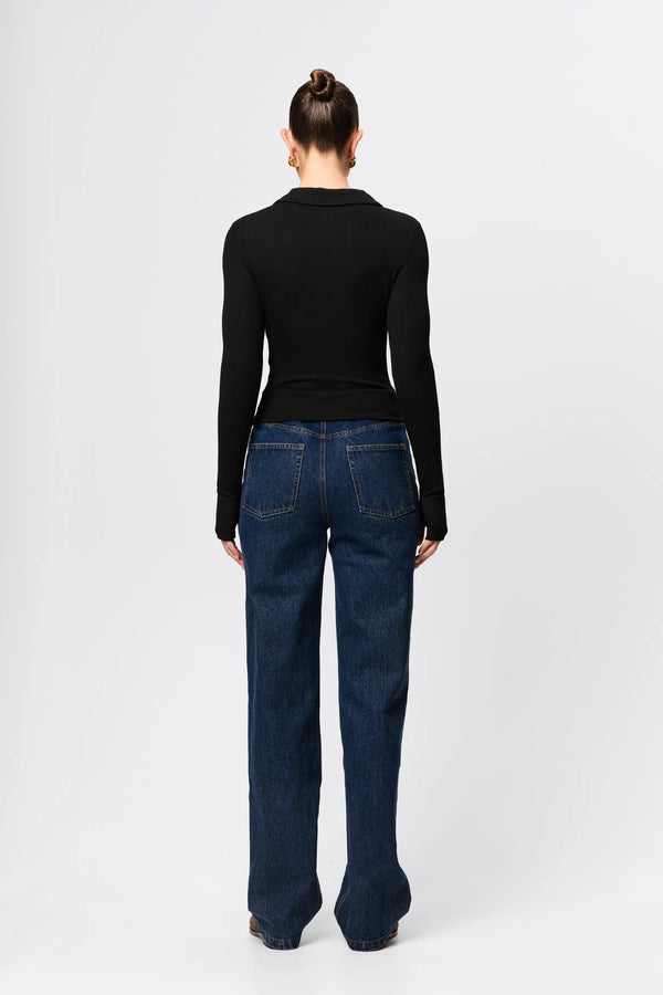 Florence Polo Top in Black by Mossman, a ribbed jersey long sleeve polo with thumb openings and sculpted fit.