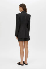 Floret Blazer by Camilla and Marc, a fitted black wool-blend blazer with shoulder pads, fabric-covered buttons and a tailored silhouette.