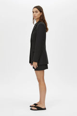 Floret Tailored Short by Camilla and Marc, a black wool-blend suiting short with resin buckle detail, belt loops and a tailored fit.
