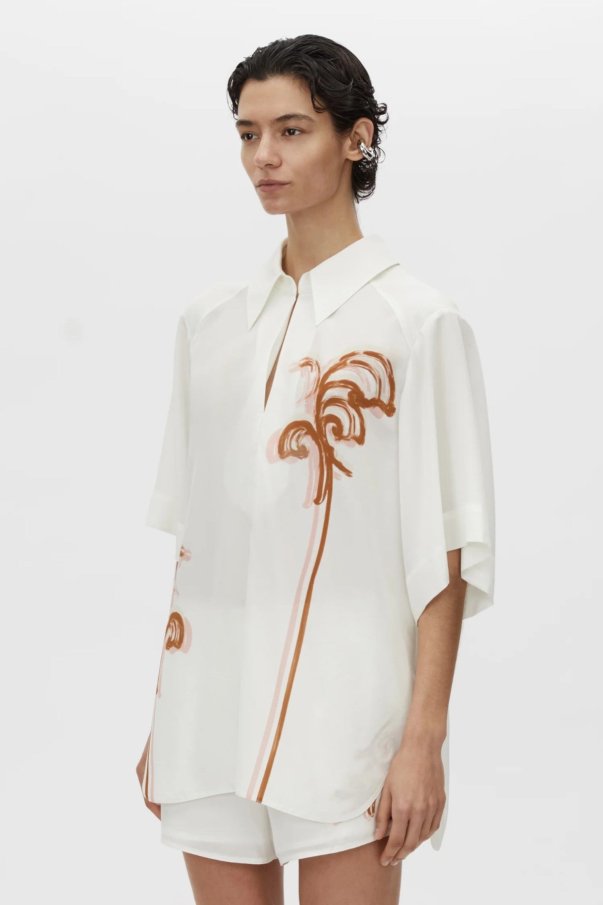 Frida Shirt Cream Frida Print by Camilla and Marc, lightweight silk top with curved hem, hook-and-eye front and modern print.