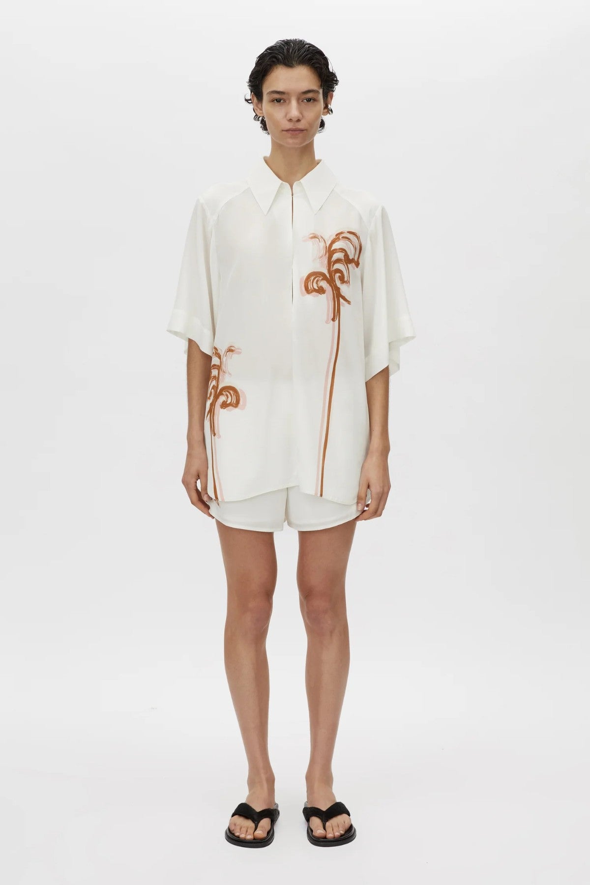 Frida Shirt Cream Frida Print by Camilla and Marc, lightweight silk top with curved hem, hook-and-eye front and modern print.