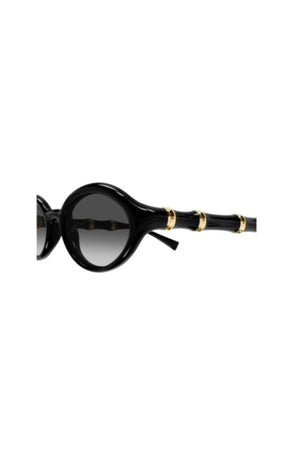 GG2059S001 Black by Gucci – oval sunglasses with bamboo detail and slim frame. Perfect for elevated styling.