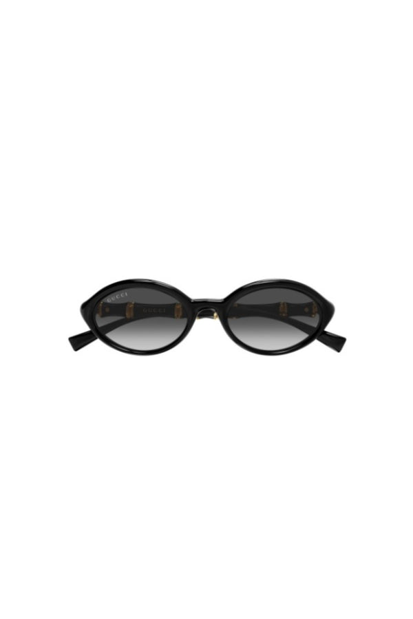 GG2059S001 Black by Gucci – oval sunglasses with bamboo detail and slim frame. Perfect for elevated styling.