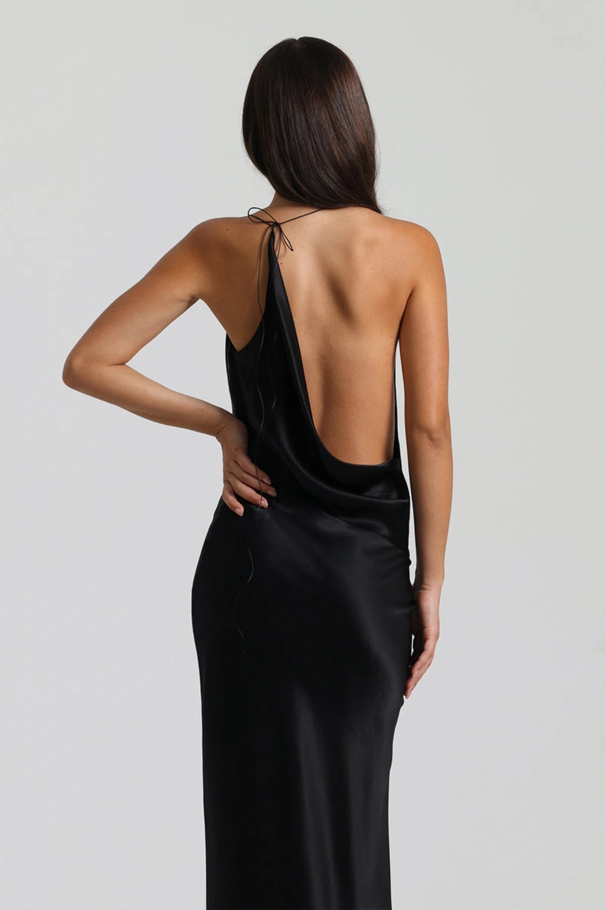 Gabi Gown in Black by Natalie Rolt, handcrafted in Australia from 100% silk with an asymmetric drape and open back for timeless elegance.