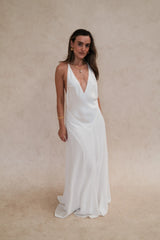 Gia V Neck Maxi Dress White by Sneaky Link – a flowy maxi with deep neckline and single strap. Perfect for elegant styling.