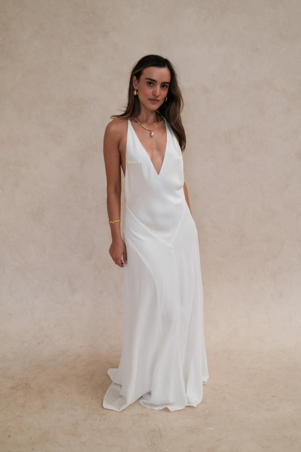Gia V Neck Maxi Dress White by Sneaky Link – a flowy maxi with deep neckline and single strap. Perfect for elegant styling.