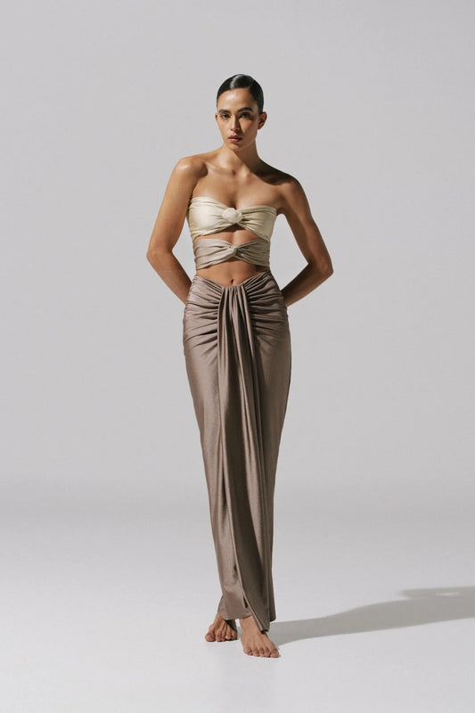 Giselle Maxi Dress by Baobab, a strapless gown with knot drape and front slit. Finished with a cascading hem and sculptural shape.