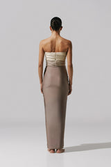 Giselle Maxi Dress by Baobab, a strapless gown with knot drape and front slit. Finished with a cascading hem and sculptural shape.
