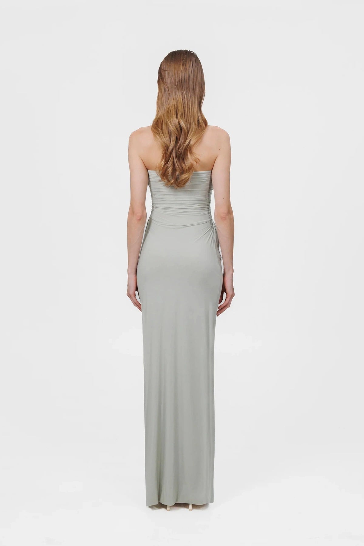 Gorgonia Dress in Sage by Maygel Coronel, a ruched strapless column gown with cowl detail. Perfect for formal or resort evenings.
