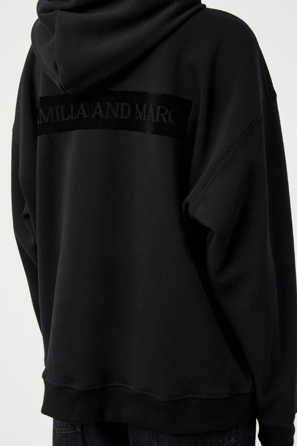 Grid Flocking Logo Hoodie Black by Camilla and Marc – Oversized fit with lined hood, flat drawcord, ribbed cuffs and hem, twin needle stitching, and subtle toothbrush flocked logo.