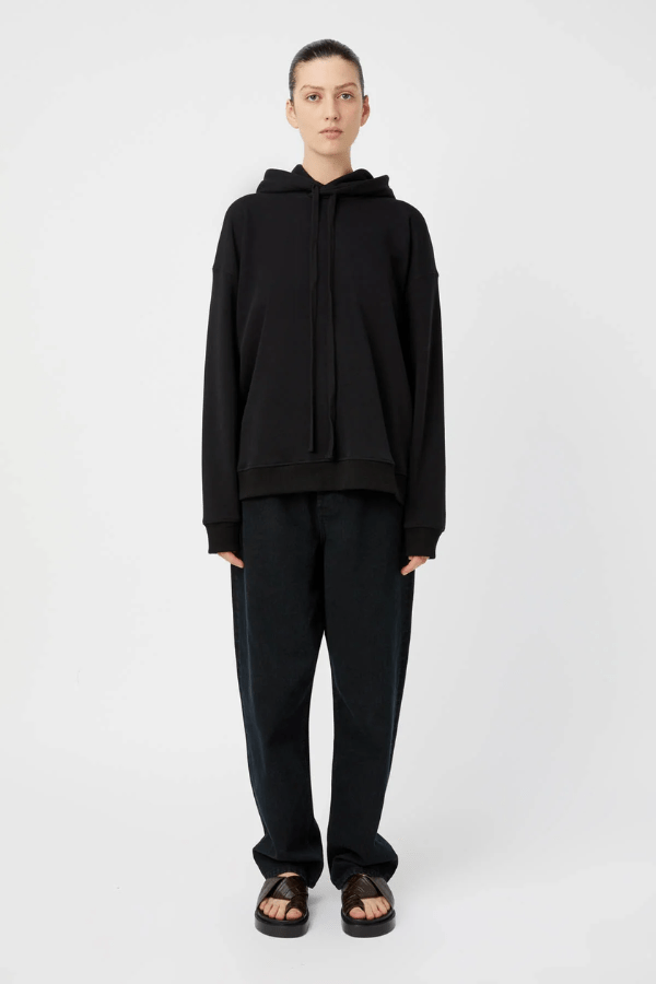 Grid Flocking Logo Hoodie Black by Camilla and Marc – Oversized fit with lined hood, flat drawcord, ribbed cuffs and hem, twin needle stitching, and subtle toothbrush flocked logo.
