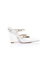 Gwen Wedge in Lucite & White Leather by Lana Wilkinson, a pointed-toe mule with adjustable strap and green lucite wedge heel.