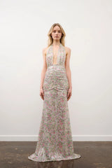 Hailey Dress in Floral Silver Sequin by DŽO, a full-length sequin gown with halter neckline, ruched waist, and floral overlay.