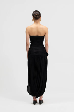 Halo Basalto by Maygel Coronel – ruched strapless midi dress with 3D floral detail and side slit.
