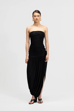 Halo Basalto by Maygel Coronel – ruched strapless midi dress with 3D floral detail and side slit.