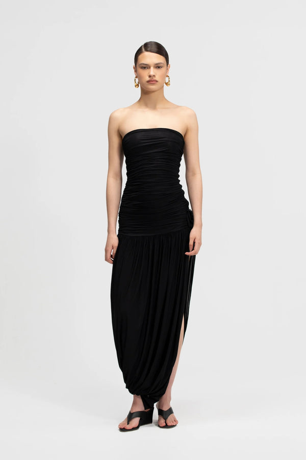 Halo Basalto by Maygel Coronel – ruched strapless midi dress with 3D floral detail and side slit.