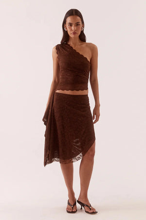 Harper Skirt Chocolate by Sovere – asymmetric lace midi skirt with waterfall drape panel and scalloped hem.