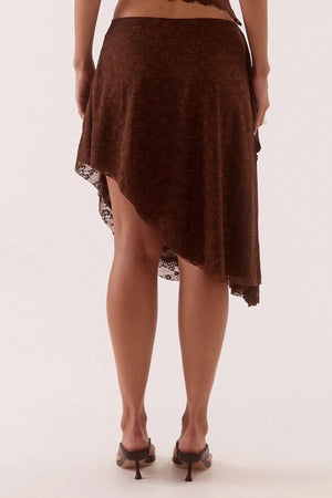 Harper Skirt Chocolate by Sovere – asymmetric lace midi skirt with waterfall drape panel and scalloped hem.