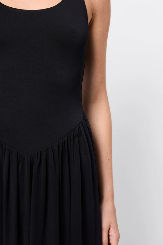 Haven Midi Dress Black by Mossman, a sleeveless sculpted midi with dipped waist and bubble hem. Perfect for day to night wear.