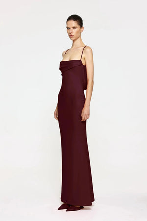 Havilland Gown in Wine by Effie Kats, elegant straight-neck silhouette with delicately draped low back, crafted in soft stretch crepe for a refined evening look.