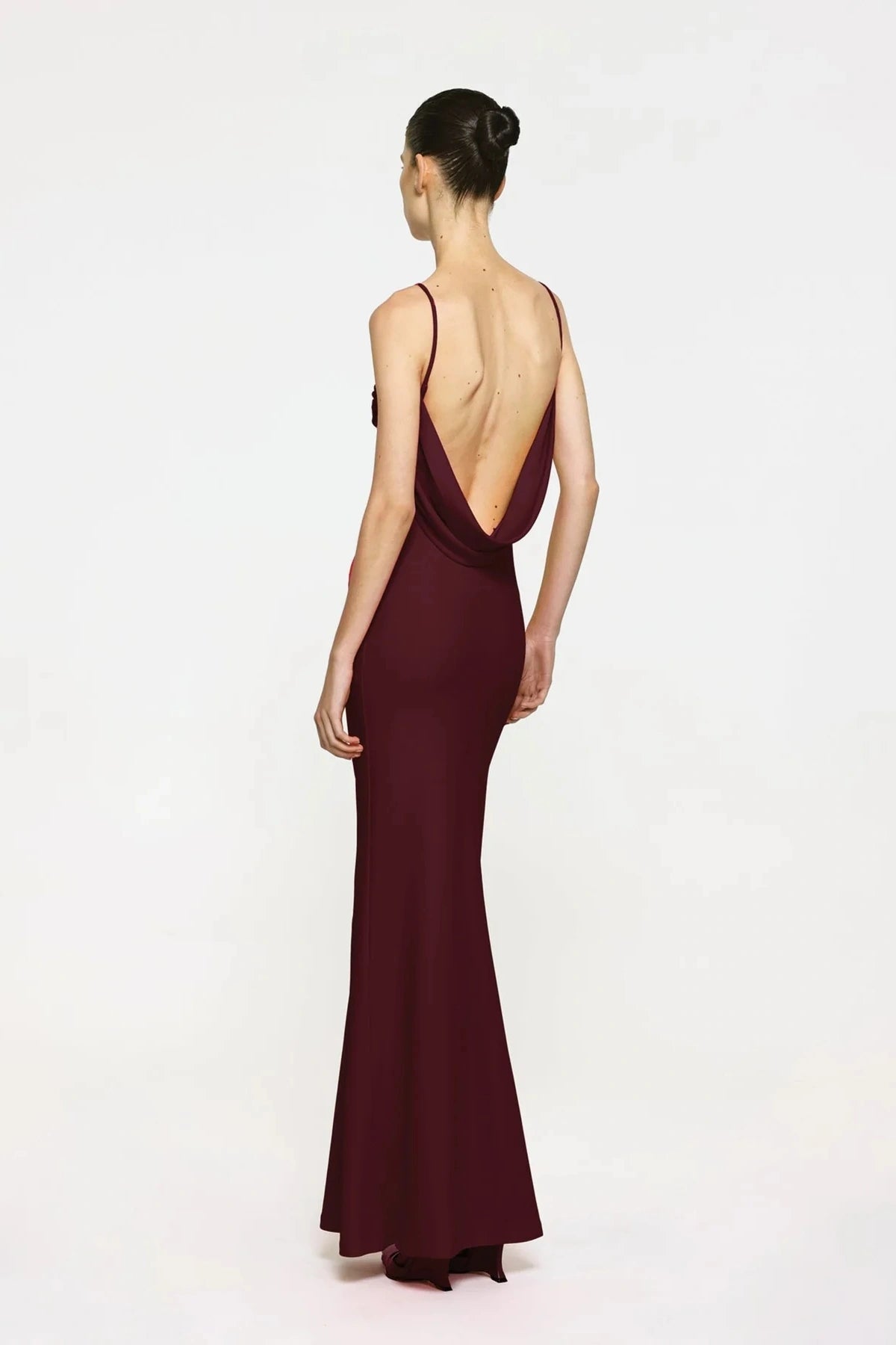 Havilland Gown in Wine by Effie Kats, elegant straight-neck silhouette with delicately draped low back, crafted in soft stretch crepe for a refined evening look.