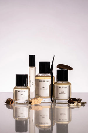 Haze by Who Is Elijah, a unisex scent with pink pepper, orange blossom, clove, chestnut, cedarwood, vanilla, and warm woods.