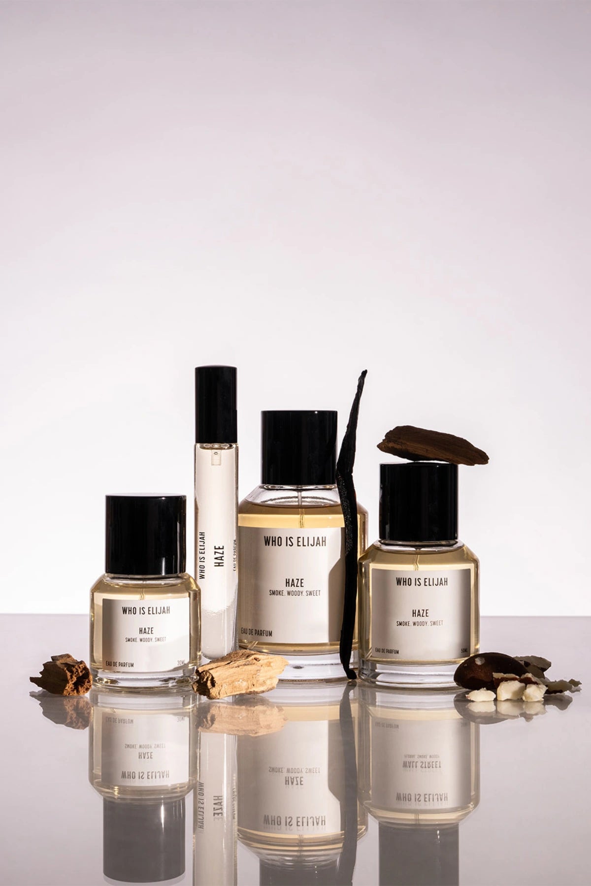 Haze by Who Is Elijah, a unisex scent with pink pepper, orange blossom, clove, chestnut, cedarwood, vanilla, and warm woods.