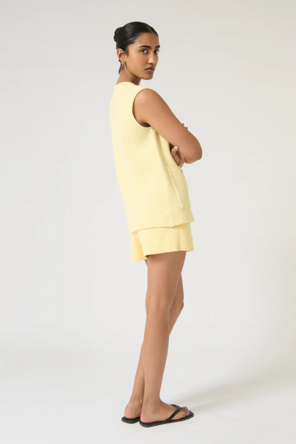 Helena Gilet by Onte, butter cotton crochet knit vest with enamel gold buttons and a relaxed sleeveless fit, perfect for layering.