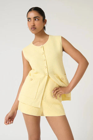 Helena Gilet by Onte, butter cotton crochet knit vest with enamel gold buttons and a relaxed sleeveless fit, perfect for layering.
