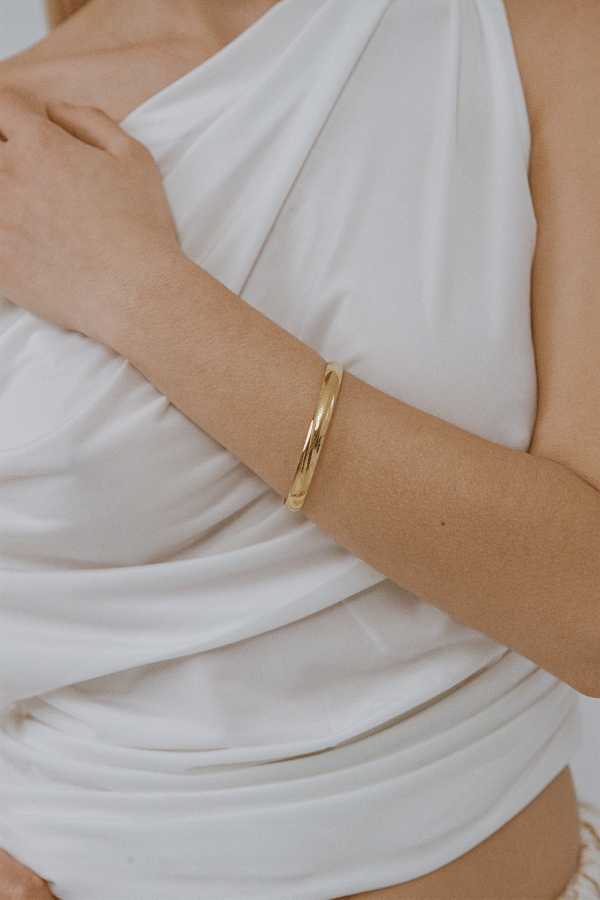 Heritage Bangle by Porter Jewellery, gold vermeil bangle with bold tube design. Perfect for stacking or statement styling.