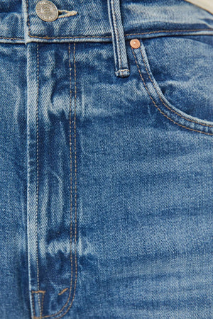 High Waisted Tunnel Vision Sneak Girls Just Want To Have Sun by MOTHER - wide leg jeans in mid blue wash, designed for a high rise fit.