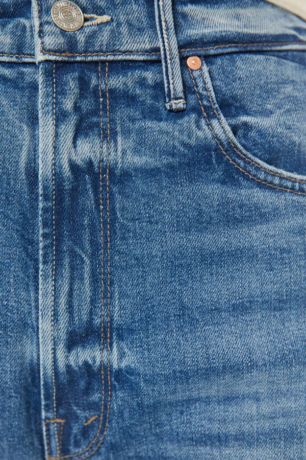 High Waisted Tunnel Vision Sneak Girls Just Want To Have Sun by MOTHER - wide leg jeans in mid blue wash, designed for a high rise fit.