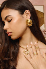 Hot In Here Gold by Emma Pills - gold statement earrings with hammered texture and hollow design, designed for a bold lightweight look.