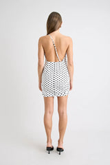Hugo Mini Dress Polka Dot by Pfeiffer, featuring a one-shoulder neckline and open back. Flattering and sculpted for standout summer style.