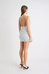 Hugo Mini Dress Polka Dot by Pfeiffer, featuring a one-shoulder neckline and open back. Flattering and sculpted for standout summer style.