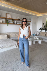 Stella High Rise Straight Leg Light Blue by Sneaky Link, classic high-waist jeans with a straight leg silhouette. Made from 100% cotton with signature SL Snake embroidery. Rigid fit; size up if between sizes. Cold delicate wash.