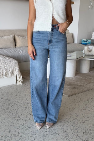 Stella High Rise Straight Leg Light Blue by Sneaky Link, classic high-waist jeans with a straight leg silhouette. Made from 100% cotton with signature SL Snake embroidery. Rigid fit; size up if between sizes. Cold delicate wash.