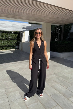 Jade Pant Black by Sneaky Link, relaxed, drapey pants in a luxe poly-viscose blend with elastic waistband, contrast panels, and adjustable drawcord. Designed oversized; size down if between sizes.