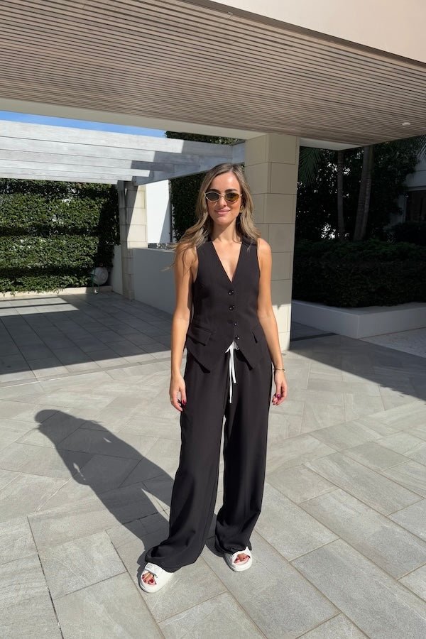 Jade Tailored Vest Black by Sneaky Link – A relaxed-fit vest crafted from luxe poly-viscose suiting with classic tailoring and a front button closure. Perfect paired with Jade Pant for a polished day-to-night look.