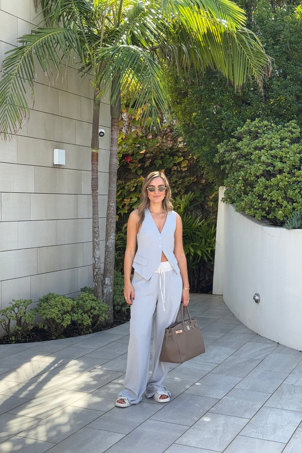 Jade Tailored Vest Steel by Sneaky Link – A relaxed-fit vest in luxe poly-viscose suiting with classic tailoring and front button closure. Pairs perfectly with Jade Pant for a polished, versatile look.