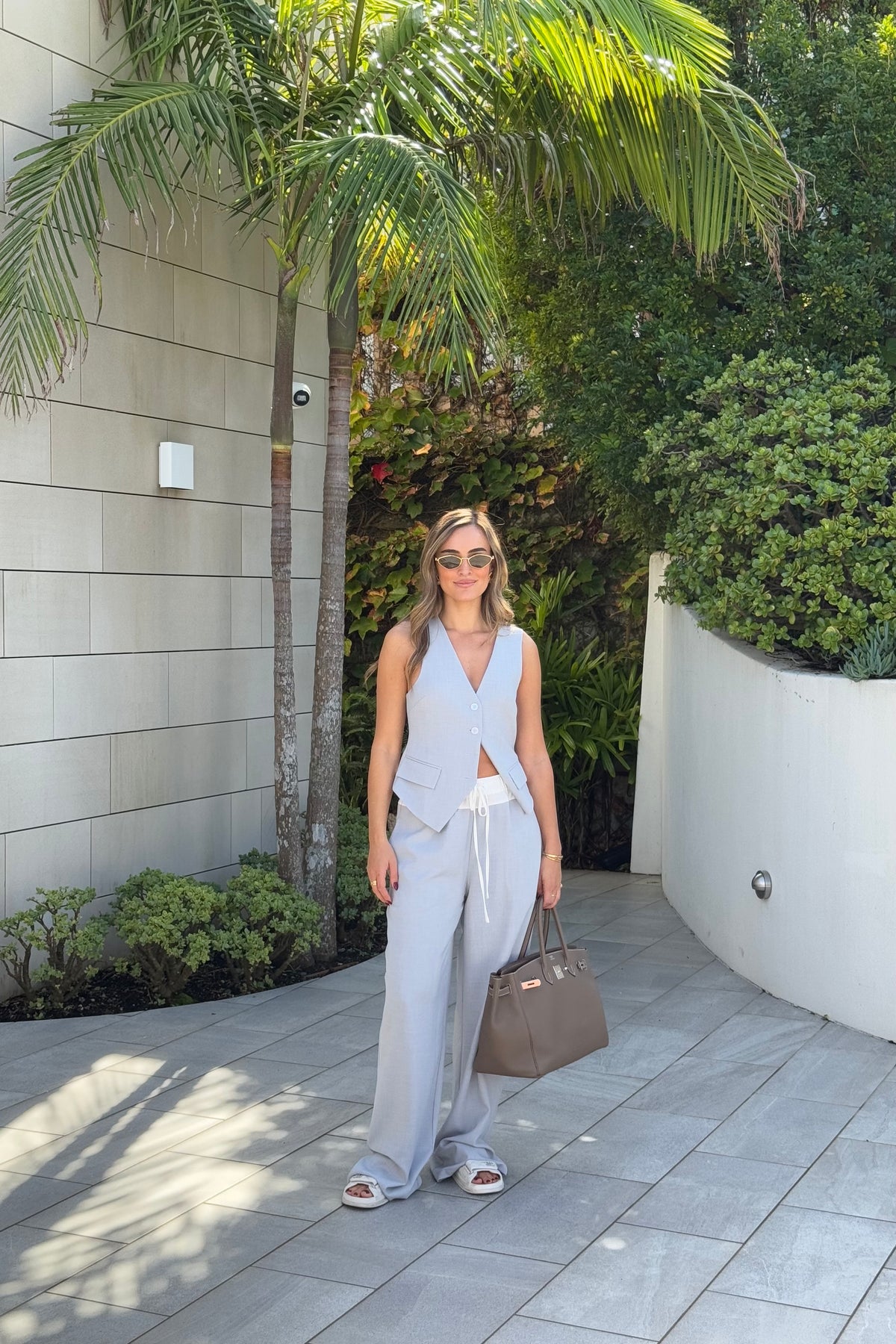 Jade Tailored Vest Steel by Sneaky Link – A relaxed-fit vest in luxe poly-viscose suiting with classic tailoring and front button closure. Pairs perfectly with Jade Pant for a polished, versatile look.