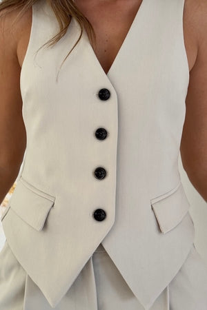 Marlie Tailored Vest Stone by Sneaky Link – Sharp, structured vest in a premium poly-viscose blend with a button front. Perfect paired with Marlie Pant. Dry clean only.